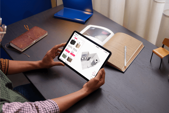 67a9e9a95a16c13acf0889b7_Female holding an iPad Air reviewing Fixtuur 3D Bathroom Planner on an iPad