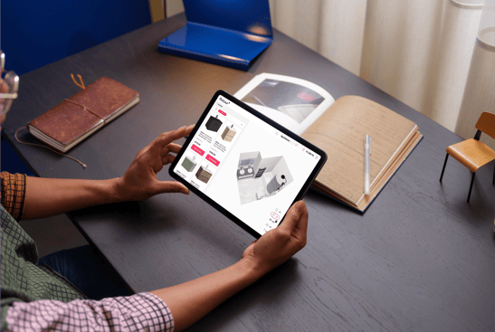 67a9e9a95a16c13acf0889b7_Female holding an iPad Air reviewing Fixtuur 3D Bathroom Planner on an iPad