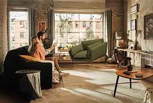 couple using 3d visualisation tools in their living room