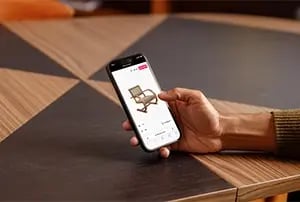 man looking at 3d product on mobile device