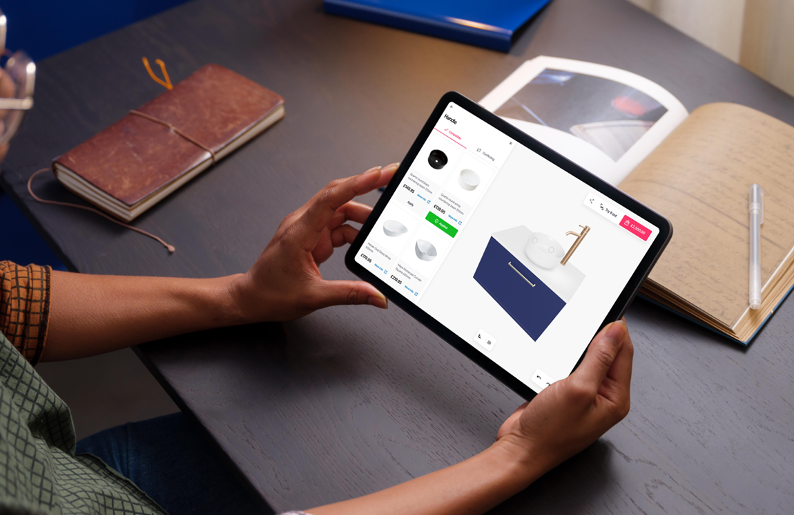 A person viewing the Fixtuur 3D configurator on an iPad at their desk, viewing all the compatible options for a bathroom vanity unit.